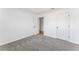 Comfortable bedroom with soft carpet, fresh white walls, and convenient closet space at 6107 Waterton Dr, Lithonia, GA 30058