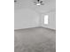 Spacious room with neutral carpet and ceiling fan at 6107 Waterton Dr, Lithonia, GA 30058