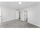 Clean bedroom with carpet and access to the bathroom at 6107 Waterton Dr, Lithonia, GA 30058