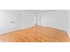 Bright bedroom features hardwood floors, double closet, and crisp white walls at 6107 Waterton Dr, Lithonia, GA 30058