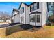 Beautiful two-story home with black mulch landscaping, large window, and charming entryway at 6107 Waterton Dr, Lithonia, GA 30058
