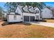 Charming two-story home with attached two car garage, landscaping and long driveway at 6107 Waterton Dr, Lithonia, GA 30058