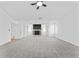 Bright, open-concept living area with modern fireplace at 6107 Waterton Dr, Lithonia, GA 30058