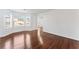 Spacious living room with hardwood floors and large windows for ample natural light at 6107 Waterton Dr, Lithonia, GA 30058