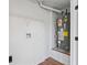 Bright utility room with storage shelves and modern water heater at 6107 Waterton Dr, Lithonia, GA 30058