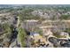 Aerial view of homes adjacent to the community golf course with mature landscaping at 10 Club Ct, Alpharetta, GA 30005