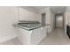 Wet bar and countertop featuring white cabinets, decorative backsplash, and tile flooring at 10 Club Ct, Alpharetta, GA 30005