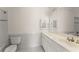 Bright white bathroom with double vanity, large mirror, and tiled floors at 10 Club Ct, Alpharetta, GA 30005