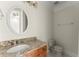 Bathroom with granite countertop, oval sink, classic vanity, and a tiled floor at 10 Club Ct, Alpharetta, GA 30005