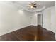 Bright bedroom featuring hardwood floors, crown molding, and a classic ceiling fan at 10 Club Ct, Alpharetta, GA 30005