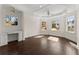 Bedroom featuring dark hardwood floors, built-in desk, recessed lighting, and multiple windows at 10 Club Ct, Alpharetta, GA 30005