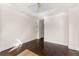 Bedroom featuring tray ceilings, hardwood floors, and a ceiling fan at 10 Club Ct, Alpharetta, GA 30005