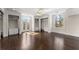 Bedroom with hardwood floors, custom shelving, and french doors to a terrace at 10 Club Ct, Alpharetta, GA 30005