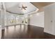 Spacious bedroom featuring bay windows, tray ceilings, built-in shelves and cabinets, and recessed lights at 10 Club Ct, Alpharetta, GA 30005