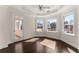 Light filled bedroom with trey ceilings, floor to ceiling windows, and access to a porch at 10 Club Ct, Alpharetta, GA 30005