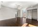 Bedroom with hardwood floors, custom shelving, and french doors to a terrace at 10 Club Ct, Alpharetta, GA 30005