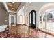 Grand foyer with high ceilings, marble floors, and arched doorways, creates a welcoming entrance at 10 Club Ct, Alpharetta, GA 30005