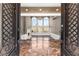 Grand entryway featuring marble floors, high ceilings, chandelier, and a view into the living room at 10 Club Ct, Alpharetta, GA 30005