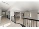 Open-concept living room with tile flooring, fireplace, high ceilings, and natural light streaming in through windows at 10 Club Ct, Alpharetta, GA 30005