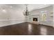 Living room with beautiful hardwood floors, fireplace and chandelier at 10 Club Ct, Alpharetta, GA 30005