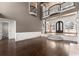 Expansive living room showcasing dark hardwood floors, a fireplace, and second story landing at 10 Club Ct, Alpharetta, GA 30005