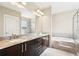 Luxurious bathroom featuring granite countertop with double sinks, a bathtub and glass shower at 1199 Huff Rd # 121, Atlanta, GA 30318