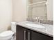 Bathroom with modern sink and dark wood cabinet at 1199 Huff Rd # 121, Atlanta, GA 30318