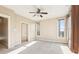 Bright bedroom featuring two windows, neutral paint, and ceiling fan, with ample natural light at 1199 Huff Rd # 121, Atlanta, GA 30318