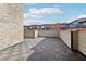 Outdoor deck area with tile flooring and surrounding buildings at 1199 Huff Rd # 121, Atlanta, GA 30318