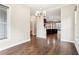 Dining room with hardwood floors, chandelier and doorway to the kitchen at 1199 Huff Rd # 121, Atlanta, GA 30318