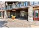 Welcoming townhome entrance featuring a secure gate and cobblestone path, leading to a charming front door at 1199 Huff Rd # 121, Atlanta, GA 30318