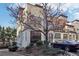 Striking three-story townhome featuring a combination of brick and stone facade with large windows at 1199 Huff Rd # 121, Atlanta, GA 30318