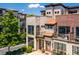 Charming townhome with a mix of brick and stone finishes, boasting a cozy balcony and well-designed facade at 1199 Huff Rd # 121, Atlanta, GA 30318