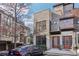 Exterior view of modern townhome with stone accents, a car parked in front at 1199 Huff Rd # 121, Atlanta, GA 30318