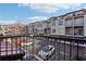 Exterior view of the complex with parking, balconies, and manicured landscaping at 1199 Huff Rd # 121, Atlanta, GA 30318