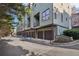 Row of townhomes with garages and small balconies; modern architecture at 1199 Huff Rd # 121, Atlanta, GA 30318