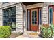 Charming front entrance with a stone pathway, colorful flowers, and a modern exterior at 1199 Huff Rd # 121, Atlanta, GA 30318