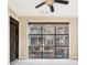 Bright living room featuring a ceiling fan and a large window providing ample natural light at 1199 Huff Rd # 121, Atlanta, GA 30318