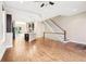 Bright and open living space with hardwood floors, stairs, and a modern kitchen at 1199 Huff Rd # 121, Atlanta, GA 30318