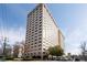 Upscale high-rise condominium building featuring brick facade and many windows at 2479 Peachtree Ne Rd # 912, Atlanta, GA 30305