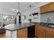 Well-lit kitchen with eat-in island, sleek countertops, and stainless steel sink at 2479 Peachtree Ne Rd # 912, Atlanta, GA 30305