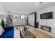 Bright living room featuring hardwood floors, neutral paint and large windows at 2479 Peachtree Ne Rd # 912, Atlanta, GA 30305