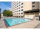 Enjoy the community pool with a covered patio and beautiful views of the high rise building at 2479 Peachtree Ne Rd # 912, Atlanta, GA 30305