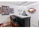 Basement bar area with decorative signage and a television at 4270 Pleasant Woods Dr, Cumming, GA 30028