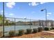 Community tennis court surrounded by a fence and greenery, in a residential neighborhood at 4270 Pleasant Woods Dr, Cumming, GA 30028