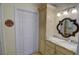 Bathroom area showcases a traditional closet with folding doors and granite vanity at 500 Bainbridge Dr, Atlanta, GA 30327