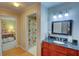 Bright bathroom with blue vanity and a view into a bedroom and shower area at 500 Bainbridge Dr, Atlanta, GA 30327