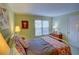 Cozy bedroom with patterned textiles, warm lighting and a view to the outside at 500 Bainbridge Dr, Atlanta, GA 30327