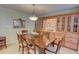 Traditional dining room with wooden table, built-in cabinets and a decorative mirror at 500 Bainbridge Dr, Atlanta, GA 30327