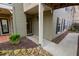 Condo entrance featuring a covered porch, exterior light fixture, and landscaping at 500 Bainbridge Dr, Atlanta, GA 30327